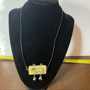 Corded necklace with rectangle cat pendant metal details